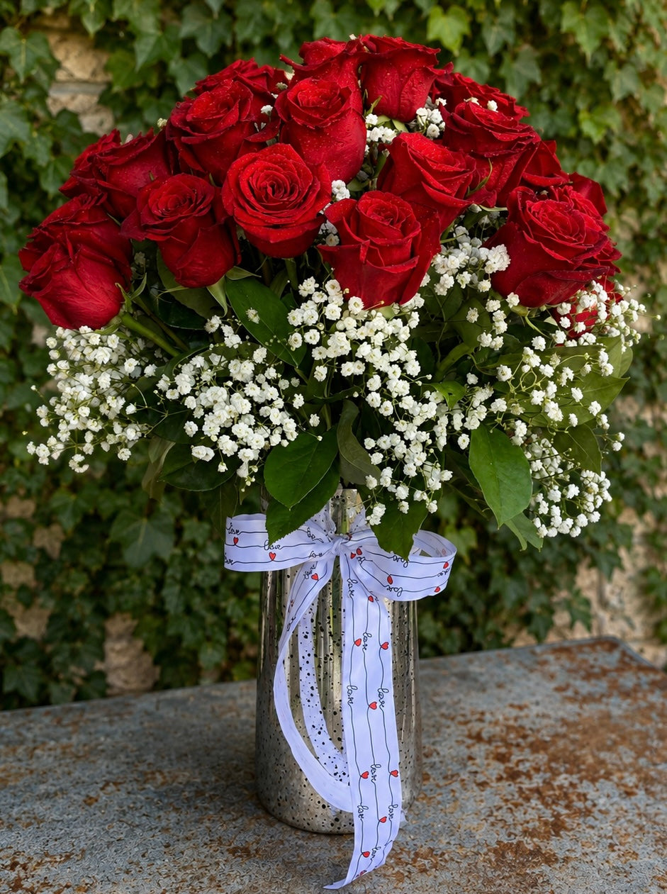 Truly Madly Deeply arrangement with 24 premium red roses, baby's breath and greenery by Dallas florist Prisma Petals